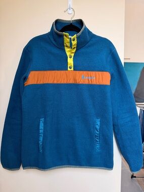 cotopaxi blue fleece jacket with black trim